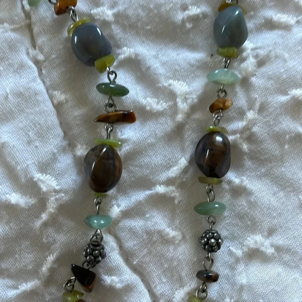 Beautiful necklace. Gray, brown and light aqua stones with silver tone accents.